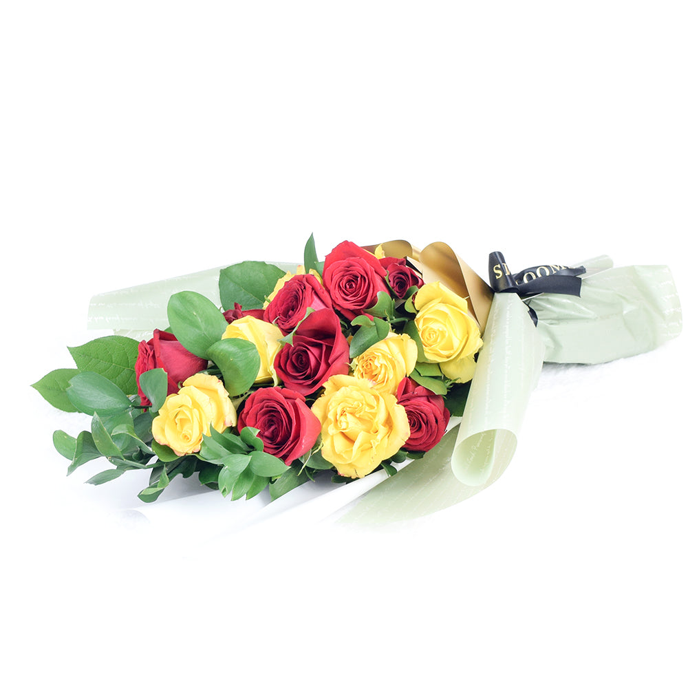 Wrapped Red and Yellow Roses – how the gift is presented