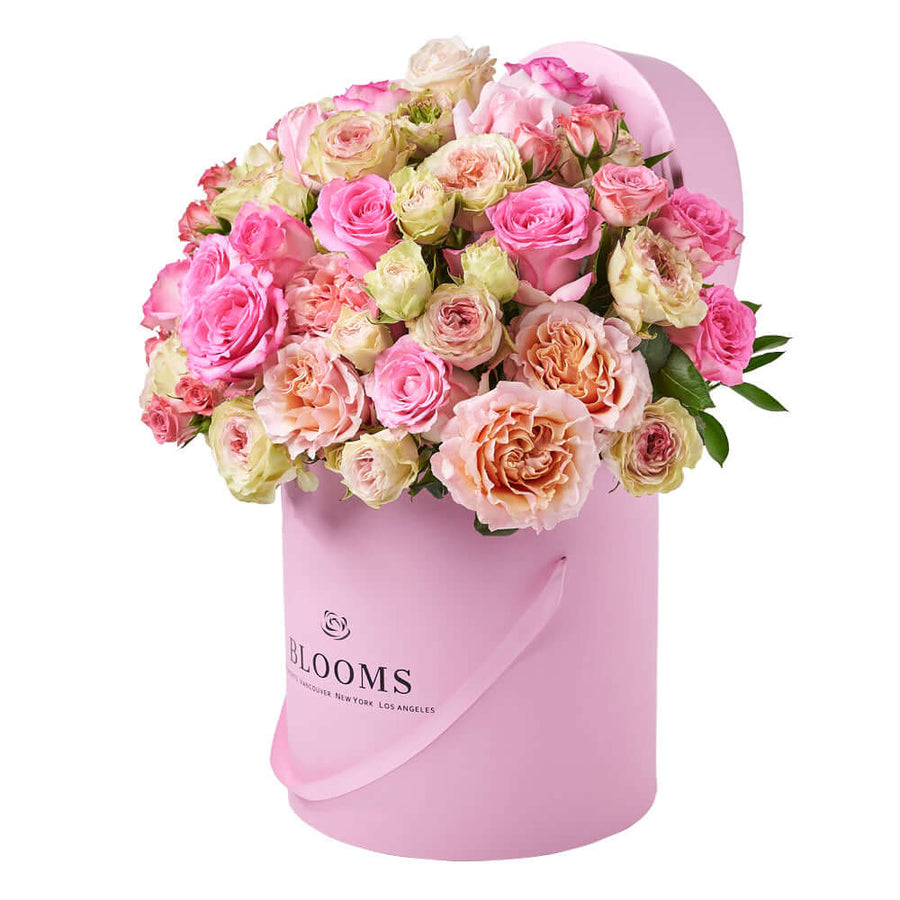 Ultimate Blushing Rose Gift, a mix of pink and white roses elegantly presented in a pink hat box, Flower Gifts from Vancouver Blooms - Same Day Vancouver Delivery.