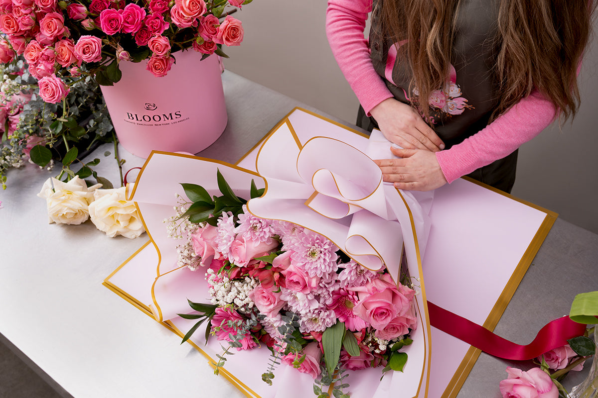 Florist designing modern floral arrangement in Vancouver studio