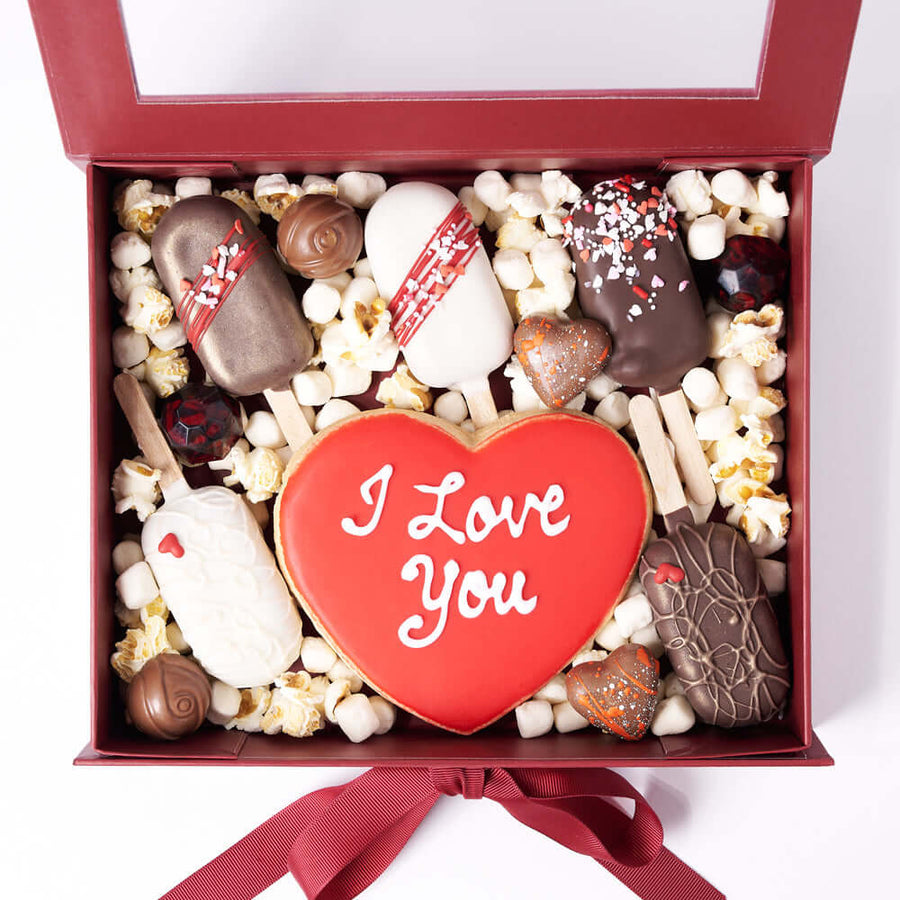 The Valentine’s Day Sweet Treat Gift Box, handmade heart cookie, 5 delectable brownies, 6 assorted chocolate truffles, marshmallows, and popcorn, all neatly packed into a hinged gift box, Valentine's Day Gifts from Vancouver Blooms - Same Day Vancouver Delivery.