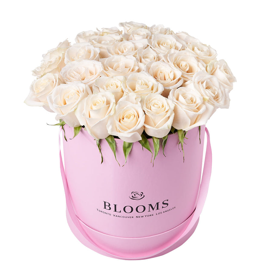 Delicate White Rose Gift Box, assortment of white roses arranged in a pink hat box for a stunning presentation, Floral Gifts from Vancouver Blooms - Same Day Vancouver Delivery.