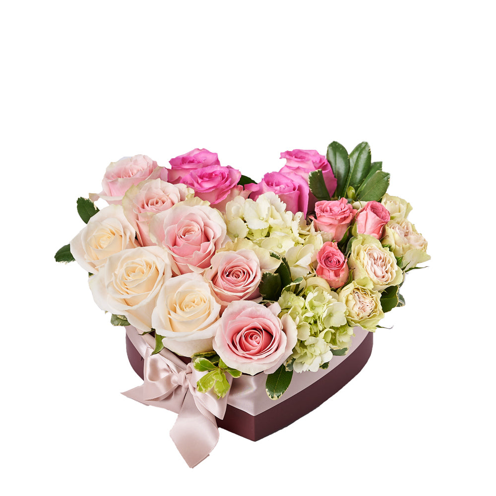 Heart of Roses Arrangement, a heartfelt gift featuring pink and white roses, hydrangea, spray roses, and more arranged in a charming heart-shaped box. Floral Gifts from Vancouver Blooms - Same Day Vancouver Delivery.