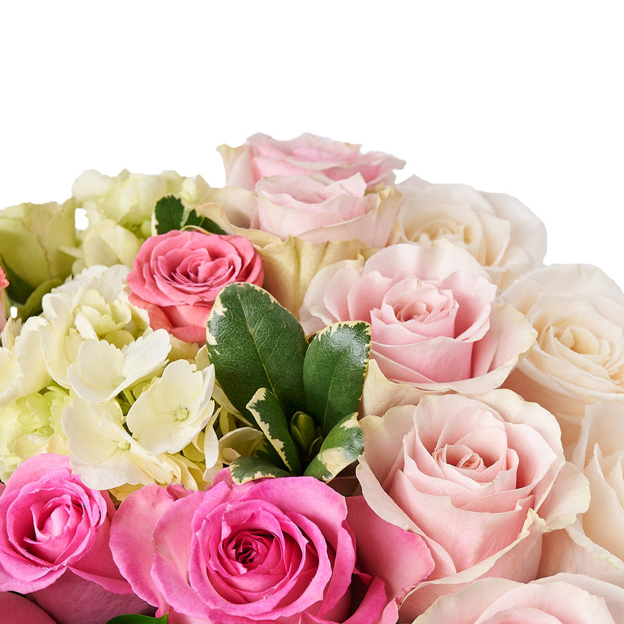 Heart of Roses Arrangement, a heartfelt gift featuring pink and white roses, hydrangea, spray roses, and more arranged in a charming heart-shaped box. Floral Gifts from Vancouver Blooms - Same Day Vancouver Delivery.