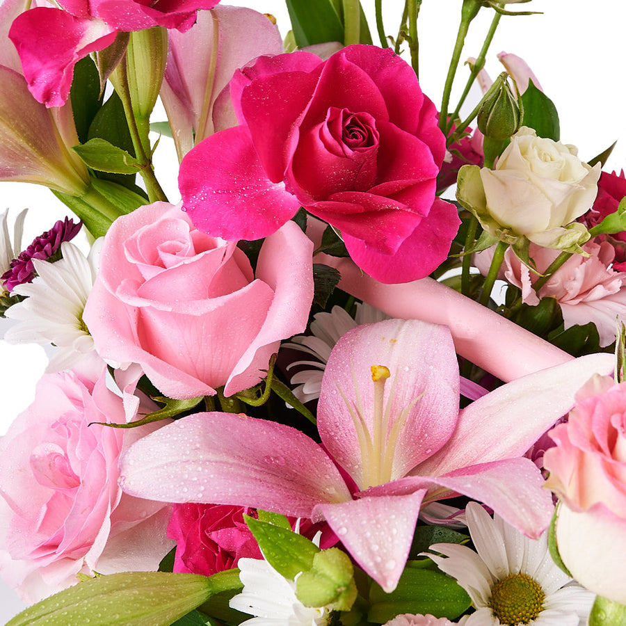 Abundance of Spring Mixed Arrangement, the freshest spring blooms, including roses, lilies, and tulips, creating a captivating addition to any space, Floral Gifts from Vancouver Blooms - Same Day Vancouver Delivery.