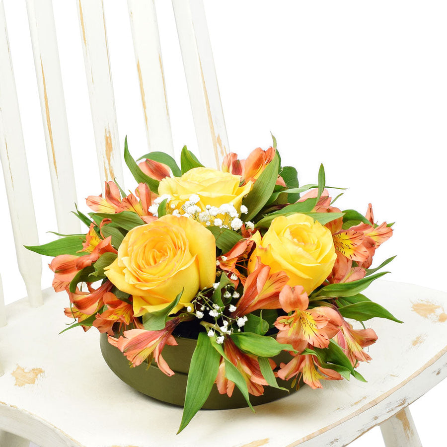 Autumnal floral hat box arrangement in yellows and oranges. Same Day Vancouver Delivery.