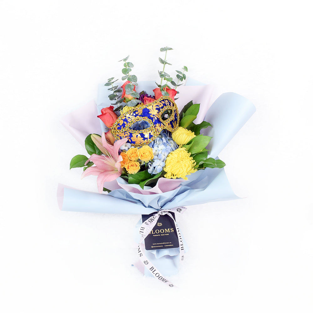 The Festive Purim Bouquet from Vancouver Blooms features a cheerful arrangement of roses, cremons and other flowers tied with a designer ribbon