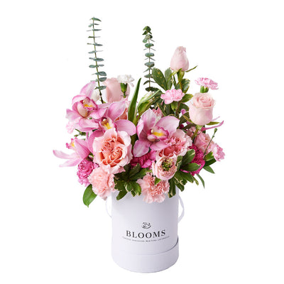 Exquisite Pink Arrangement, Lush shades of pink with an assortment of fresh flowers, including orchids, roses, tulips, and more. Presented in a round white box, Floral Gifts from Vancouver Blooms - Same Day Vancouver Delivery.