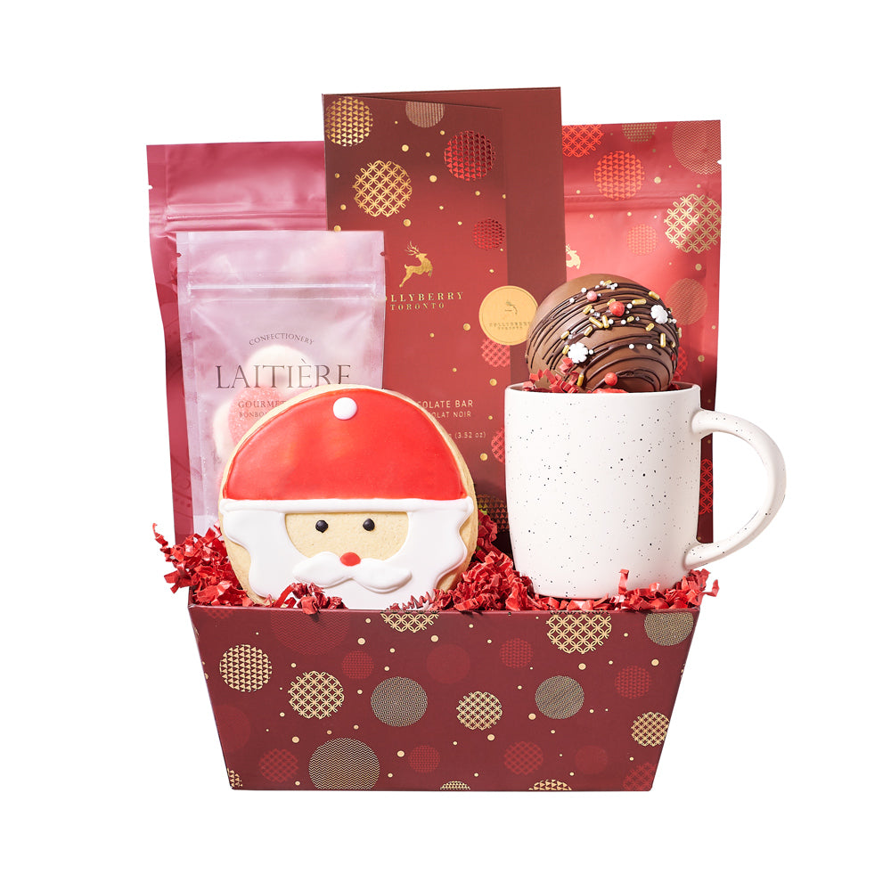 Holiday Hot Chocolate & Treat Gift Tray, charming speckled mug, a delightful hot chocolate bomb, a decadent chocolate bar, cherry cream gummy rings, milk chocolate chip shortbread cookies, white chocolate cranberry pistachio bark, a handmade Santa cookie, and a holiday-themed gift tray, Holiday Gifts from Vancouver Blooms - Same Day Vancouver Delivery.